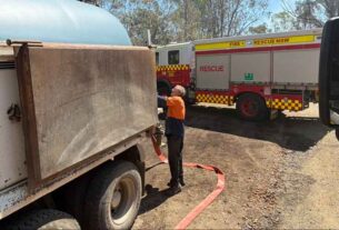 Water lifeline: Booral family steps up in Stroud blaze