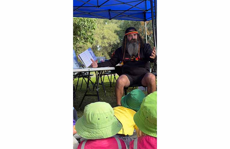 Uncle Justin Ridgeway sharing the Dreaming story of Yapii the platypus. Photo: Rachel Barry.