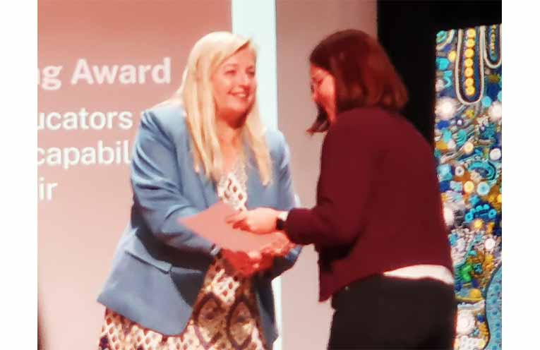 Alison Penfold, Member for Lyne, presenting an award.