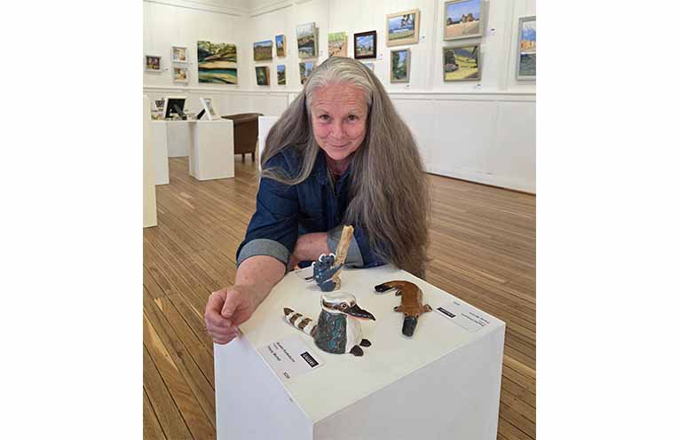 Tracey Murrell with some of her pottery, inspired by the wildlife around her Gloucester River home, part of the diverse range of works on show at Gloucester Gallery. Photo: Sonja Duncan.