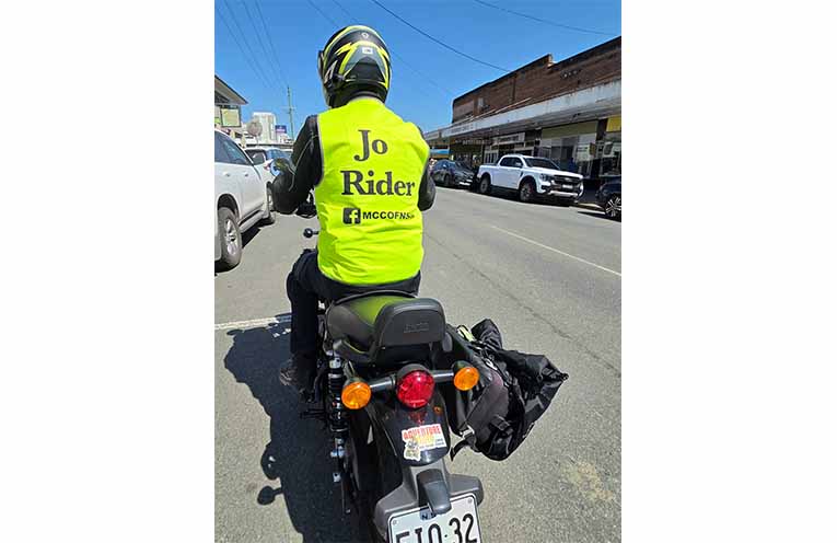 LOOK AGAIN: Brian Beesley in his distinctive Jo Rider vest on Church Street, Gloucester, encouraging motorists to actively look for motorcycles. Photo: Sonja Duncan.